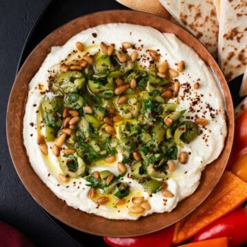 Creamy whipped feta topped with marinated olives and toasted pine nuts.