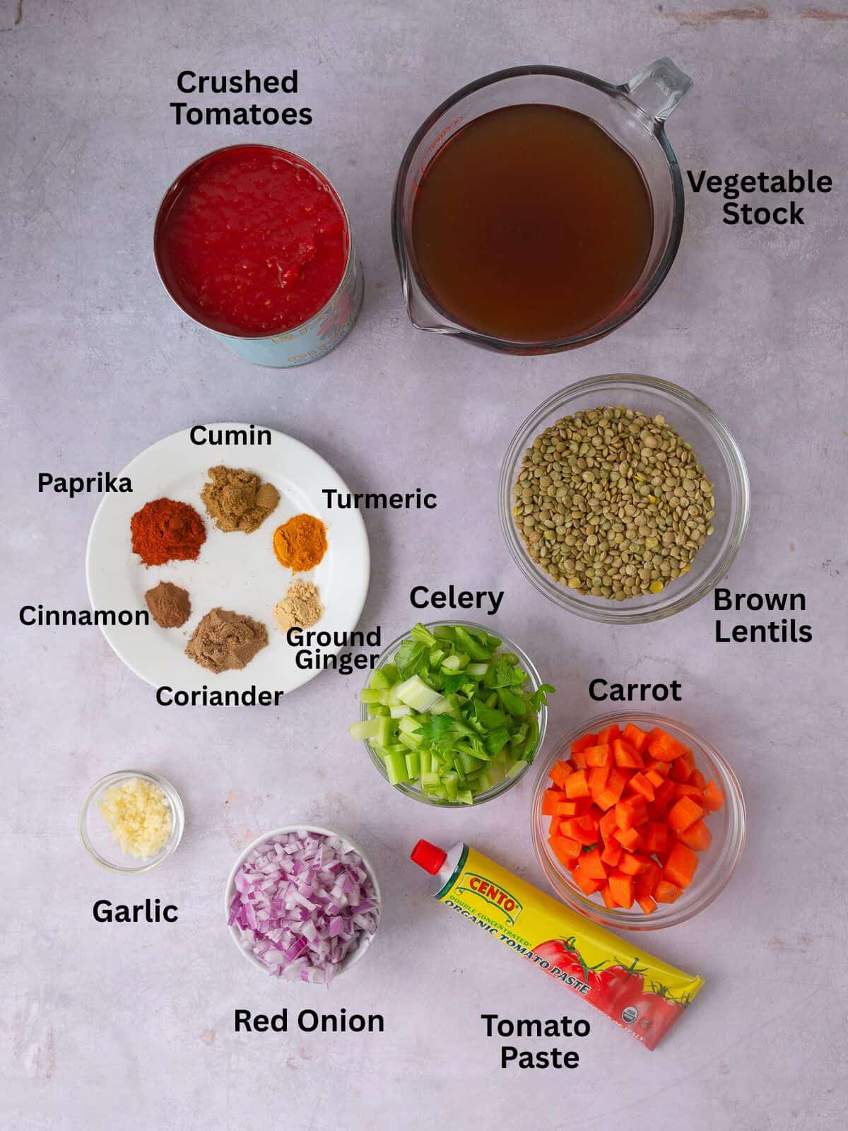 Ingredients for Moroccan lentil soup, including spices, crushed tomatoes, vegetable stock and aromatics.