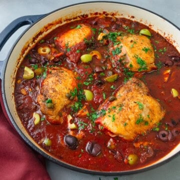 This easy chicken puttanesca recipe has seared chicken in a savory tomato sauce with olives and capers.