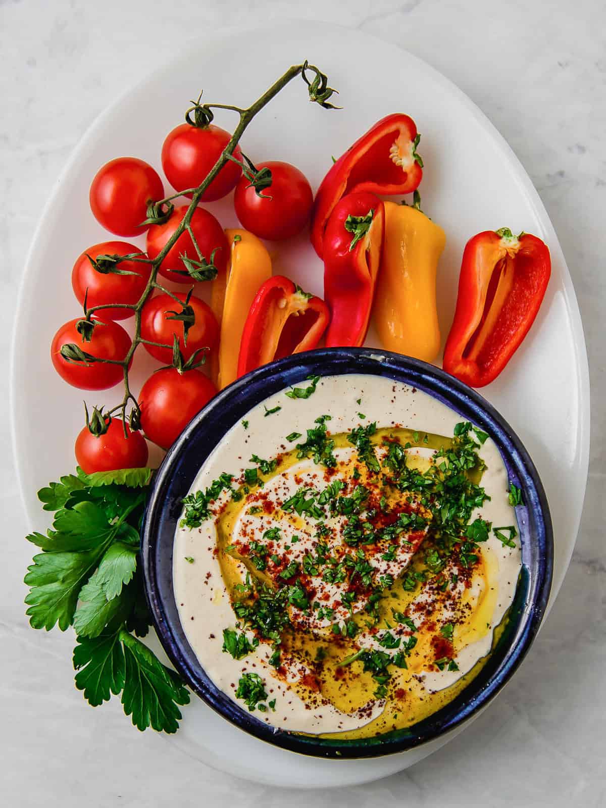 This creamy lemon tahini sauce is a Mediterranean staple! Drizzle over grilled meats, vegetables or use as a dip.