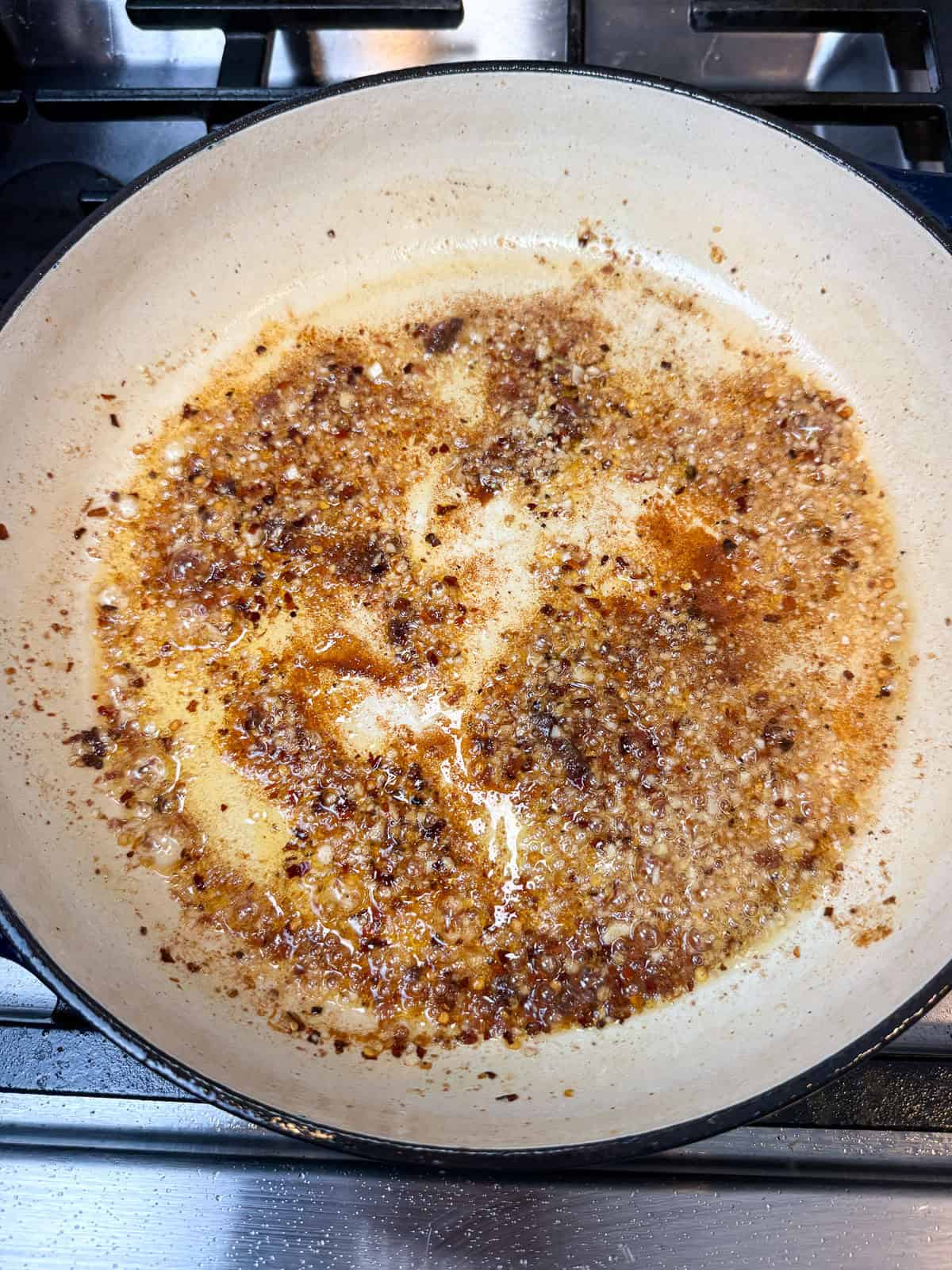 Saute anchovies in olive oil.