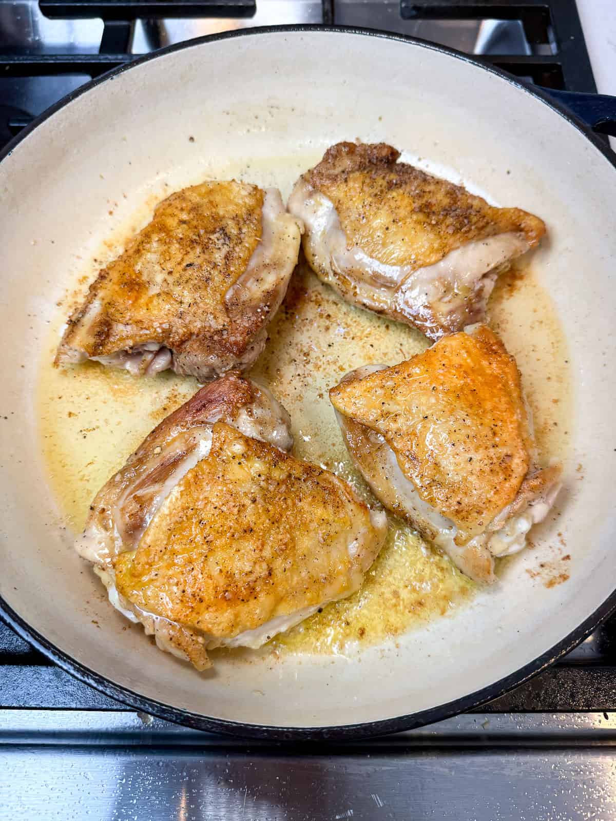 Sear the chicken thighs on both sides until deeply golden, then set aside before you make the puttanesca sauce,
