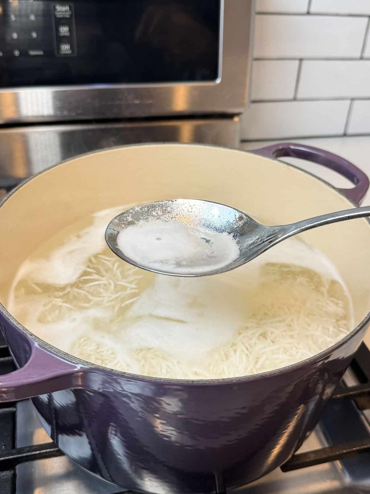 While the rice par-boils, use a spoon to skim off any foam that floats to the top.