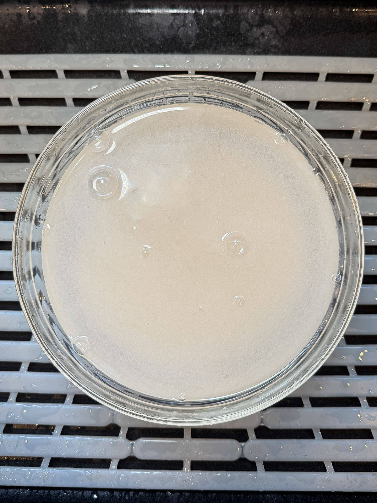 Add rice to a large bowl and fill with water, it will look cloudy so be sure to rinse it several times until the water runs clear.