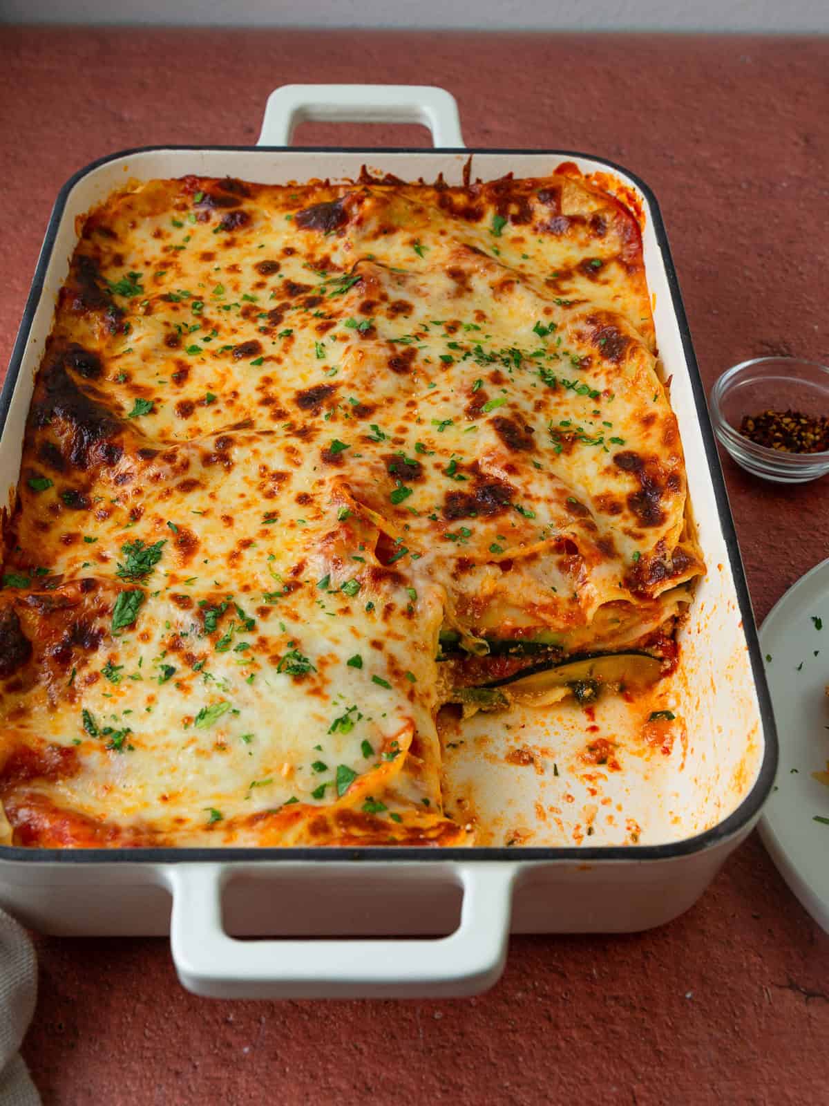 Vegetarian zucchini lasagna is a lower carb lasagna layering spinach, ricotta, mozzarella, pasta sheets and zucchini slices.