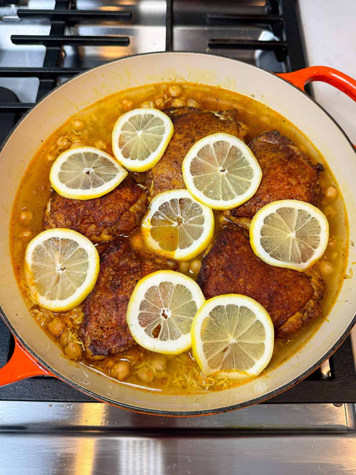 Pour chicken stock around the chicken, making sure the chicken skin stays dry.