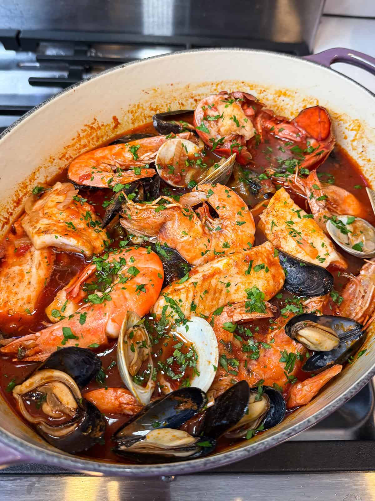 Simmer everything until cioppino is done and seafood is perfectly cooked.