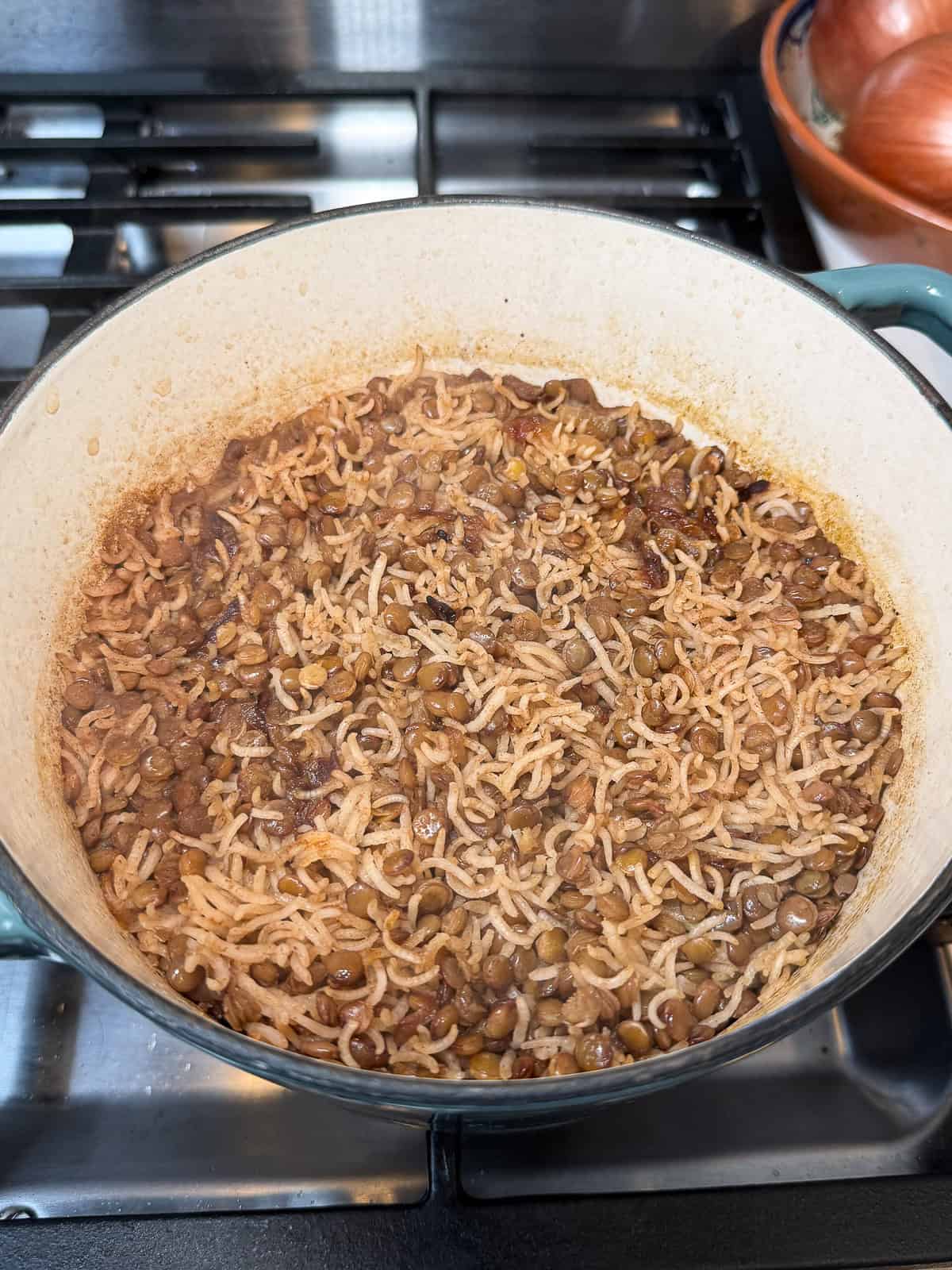 Cook the lentils and rice together until both are cooked through and tender, then fluff with a fork.