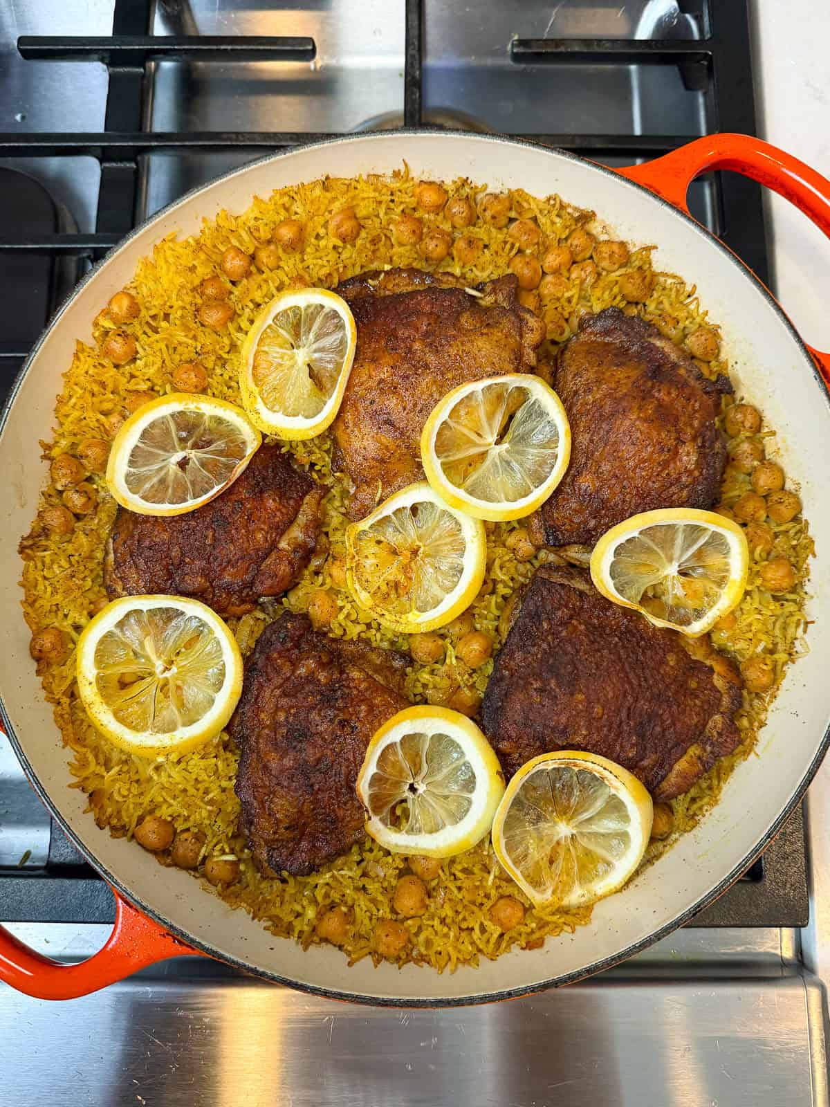 Cook the one pot chicken and rice until the chicken is cooked through and liquid has absorbed.