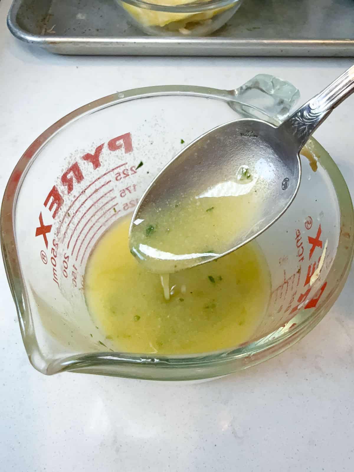 Make a simple lemon vinaigrette by mixing olive oil, dijon mustard, fresh lemon juice and chopped parsley.