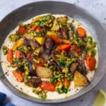 Roasted carrots with creamy tahini sauce and topped with lemony pistachios.