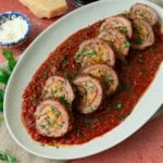 This Italian beef braciole is rolled with prosciutto and parmesan and simmered in a rich tomato sauce until perfectly tender.