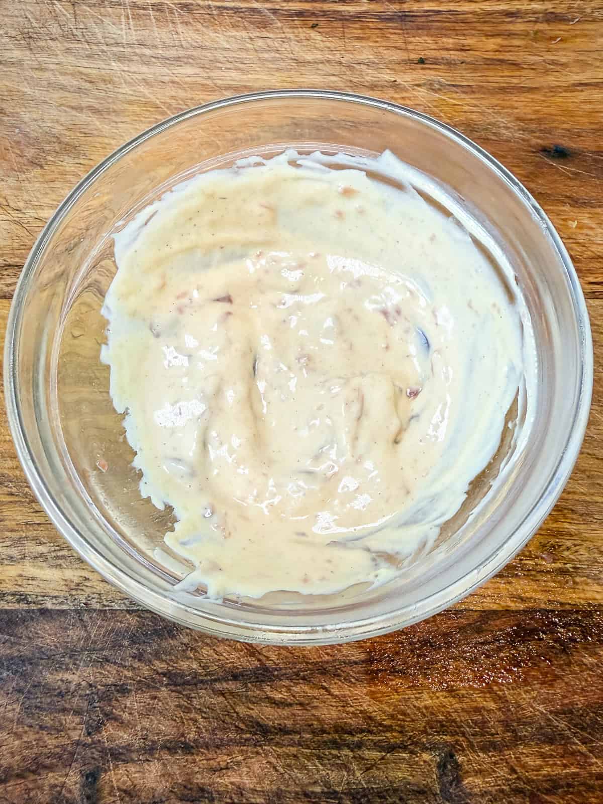 Mix mayonnaise, dijon and anchovies together to make a savory spread for the nicoise sandwich.