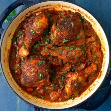 One pot sazon chicken is a bold weeknight dinner and layered with black beans, tomatoes and sofrito.