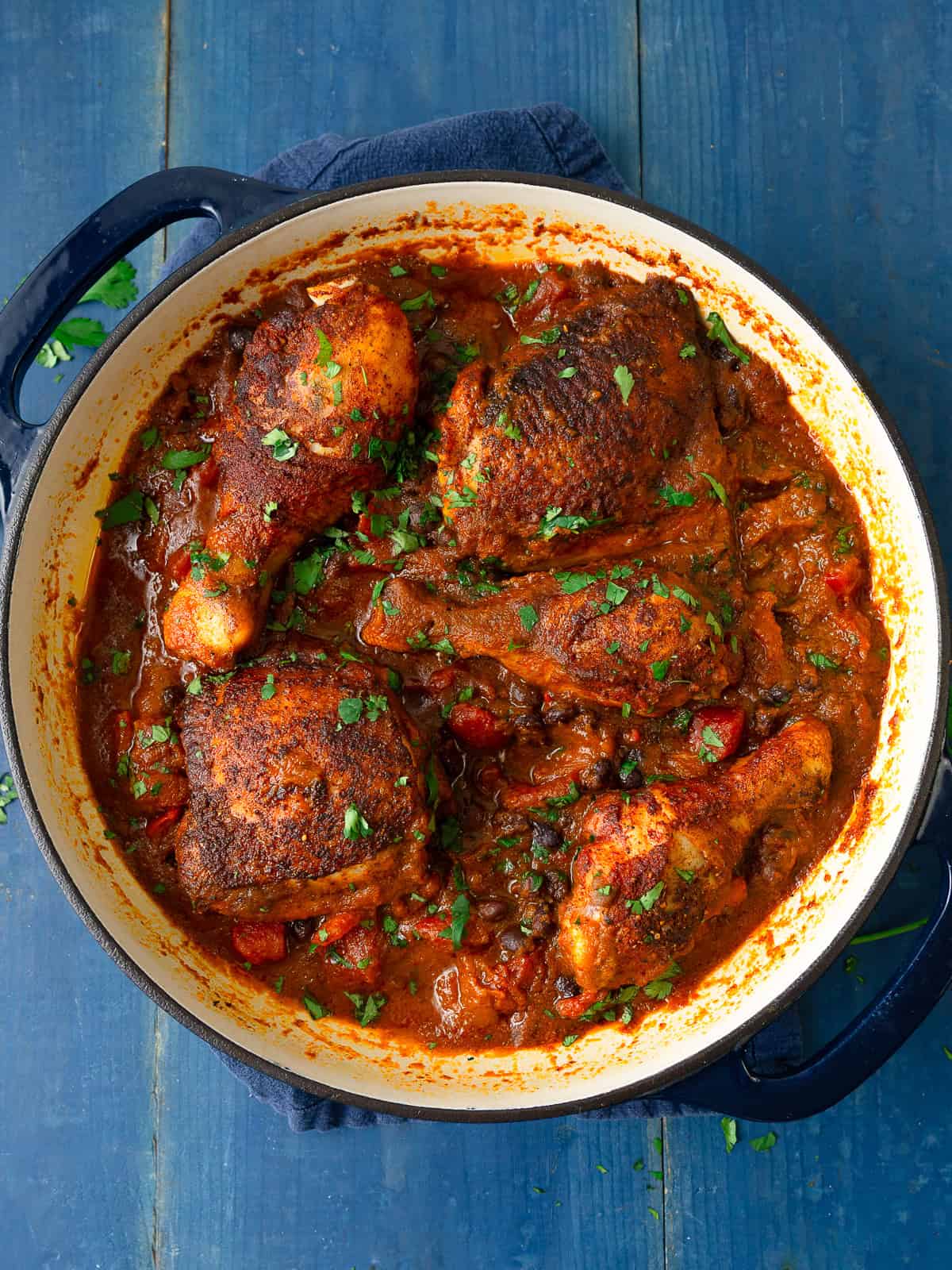One pot sazon chicken with black beans and tomatoes.