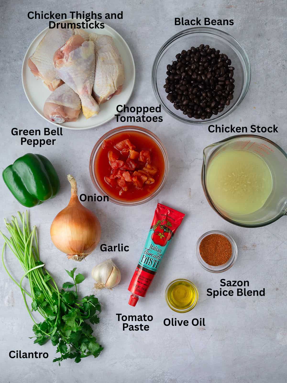 Ingredients for sazon chicken with black beans, tomatoes, and sofrito.