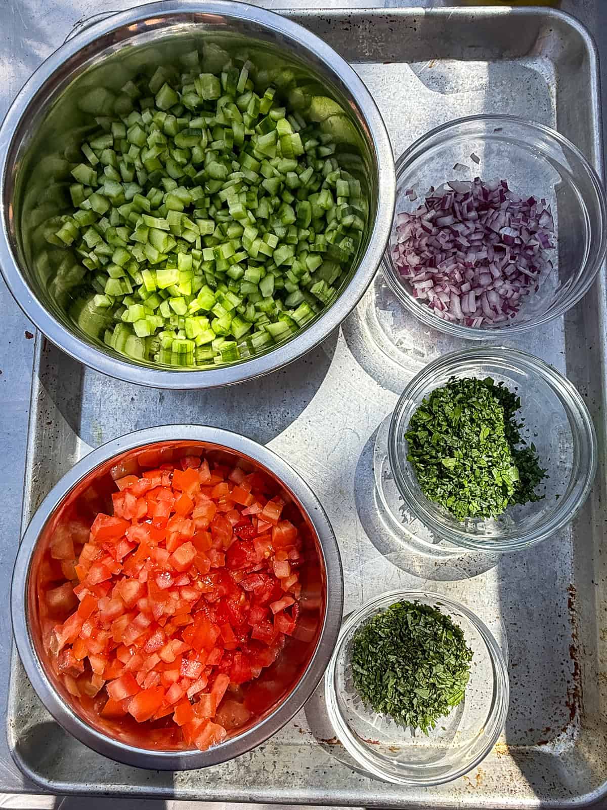 Prep the shirazi ingredients and dice the tomatoes, cucumbers and onion into small cubes.