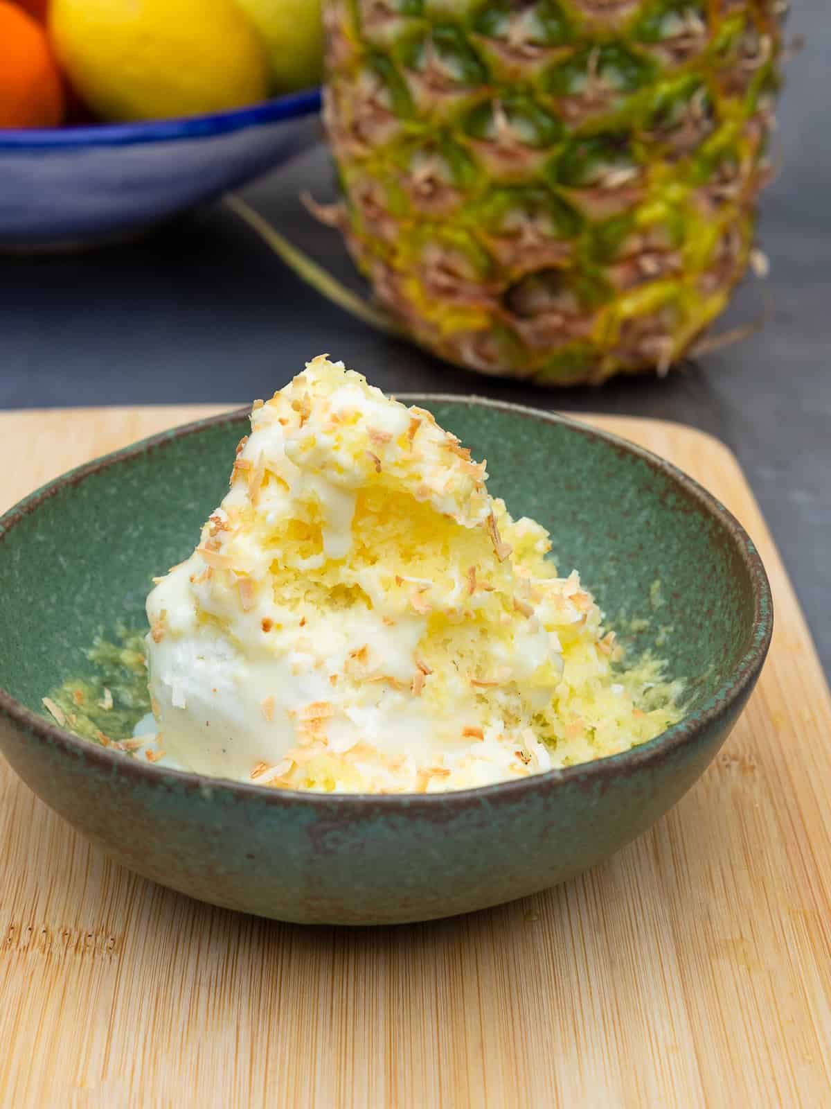 This easy desert is made up of frozen shaved pineapple, vanilla ice cream and finished with condensed milk and toasted coconut.