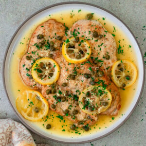This lemon chicken piccata has tender chicken cutlets served with a lemony butter caper sauce.