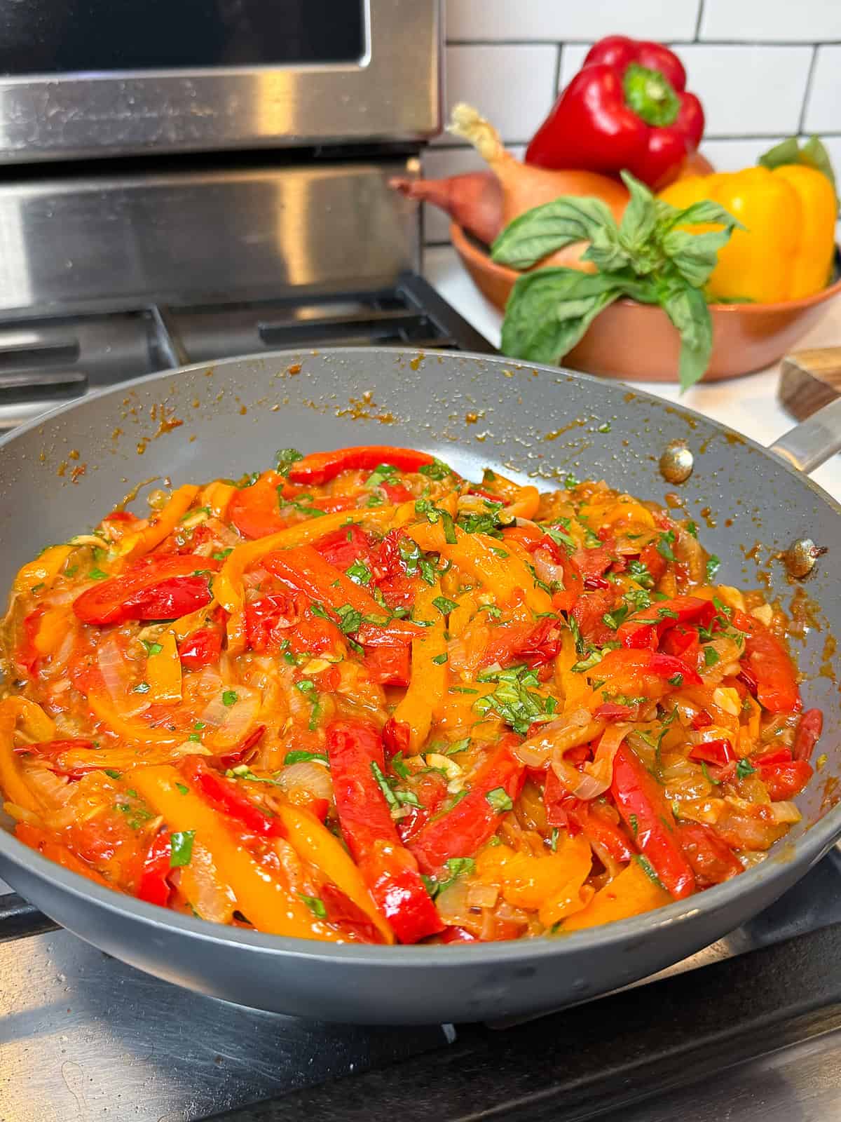 Saute the onions and bell peppers until soft and jammy.