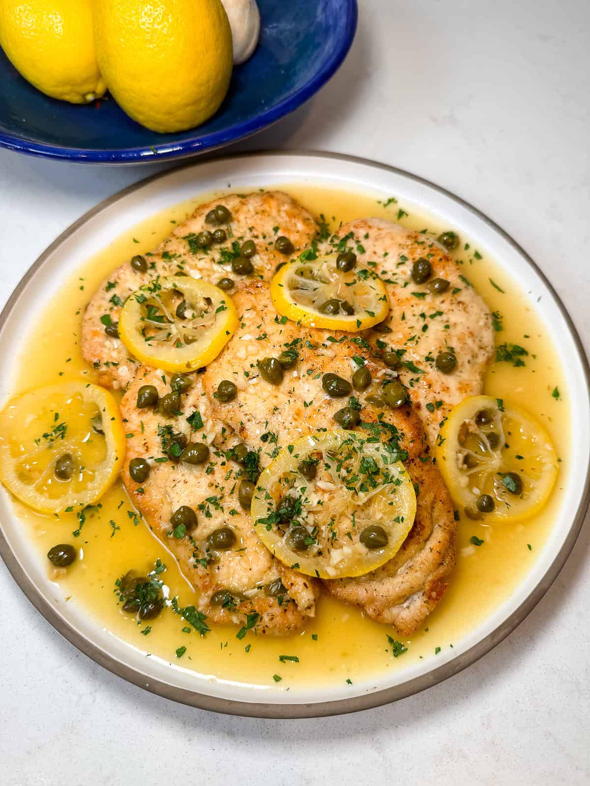 Serve the chicken piccata with the lemon caper sauce.