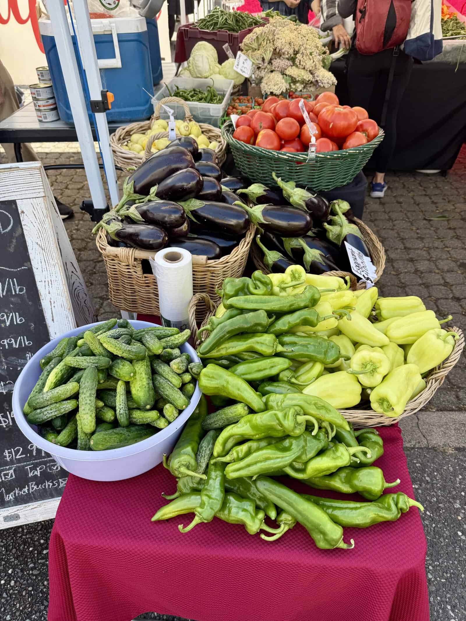 Colorful peppers, cucumbers and eggplant at the farmers market.