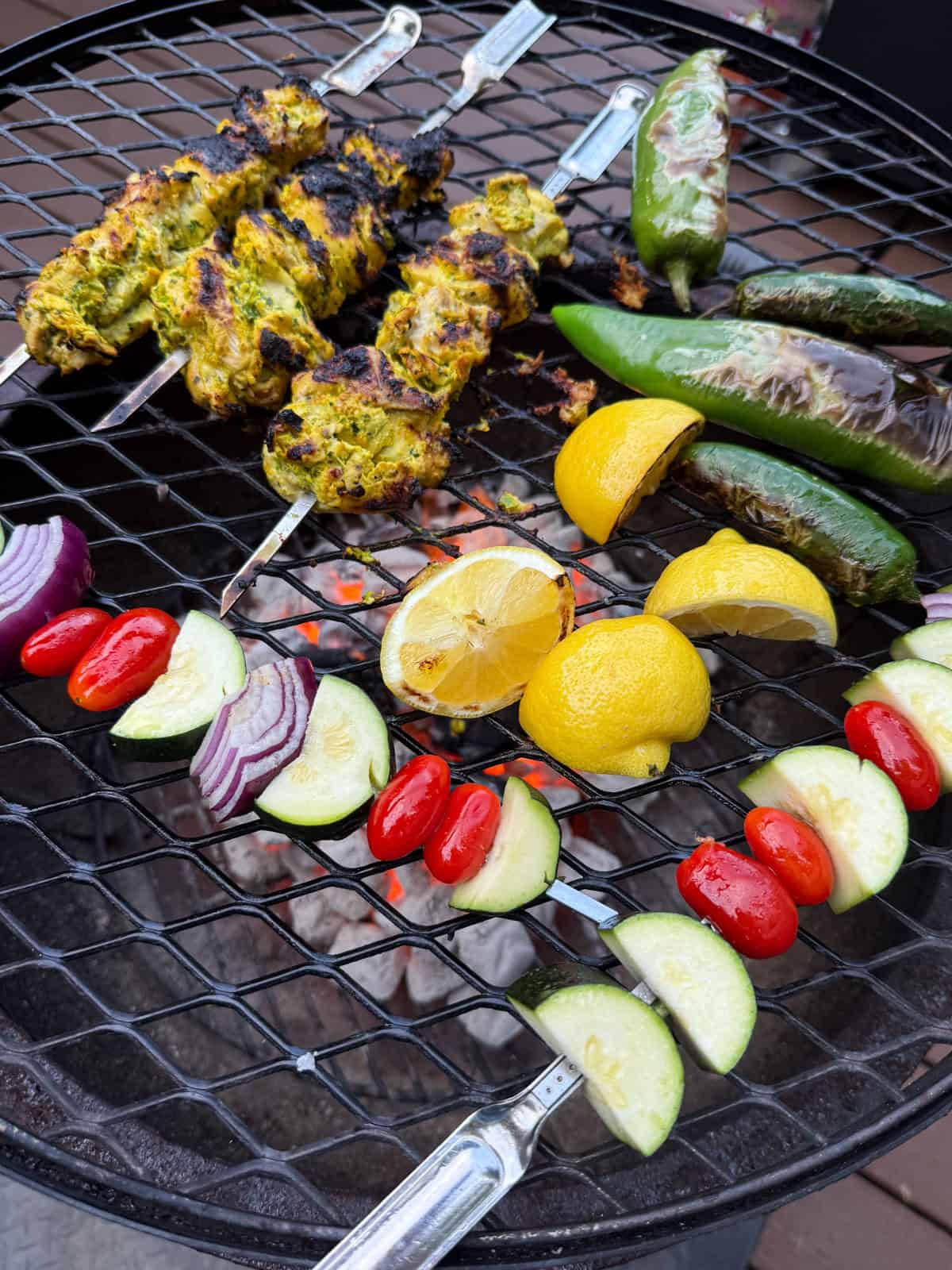 Grill the saffron yogurt chicken kabobs alongside grilled vegetable skewers and whole peppers.