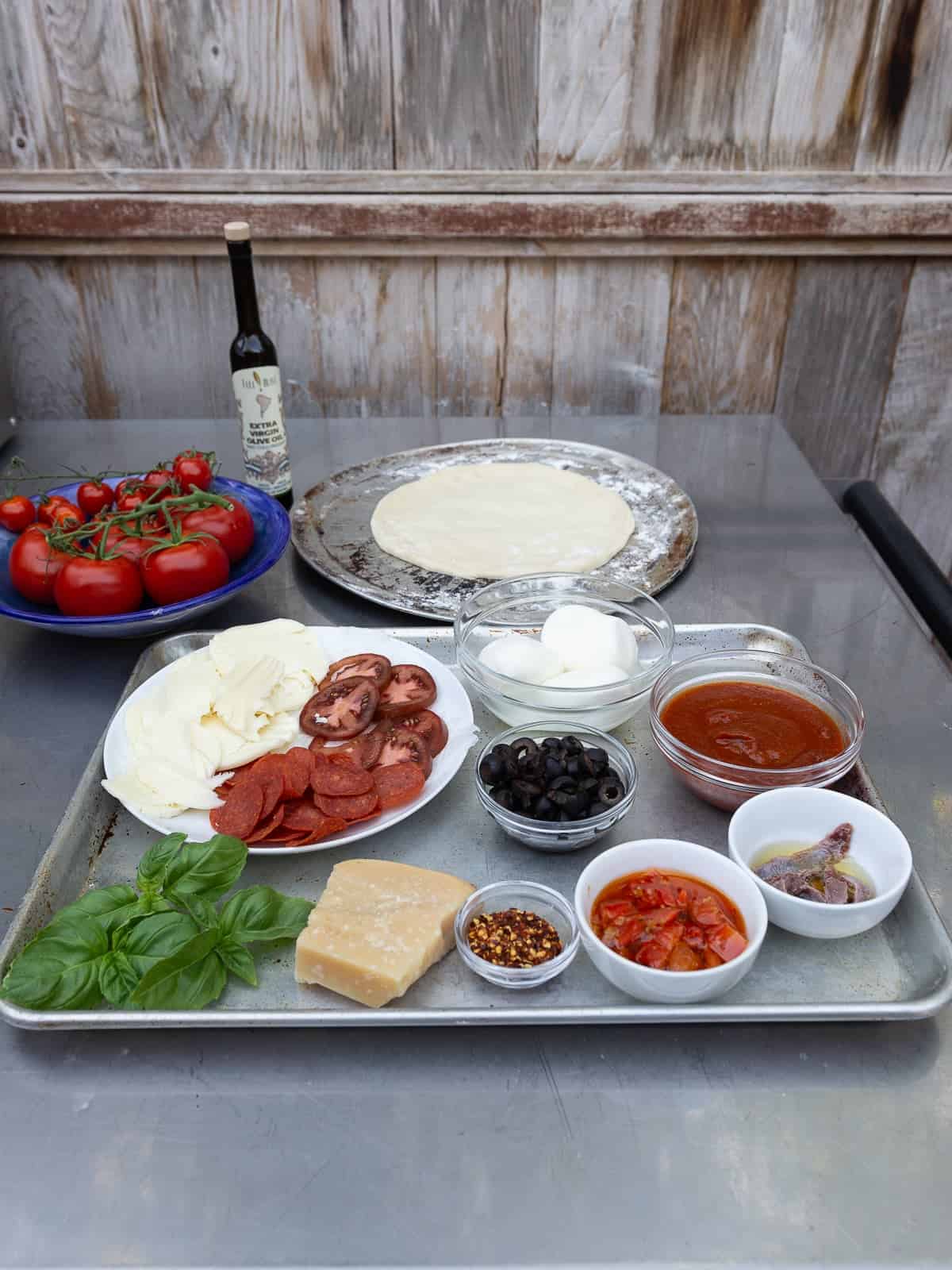 Have the ingredients for the grilled pizza prepped and ready.