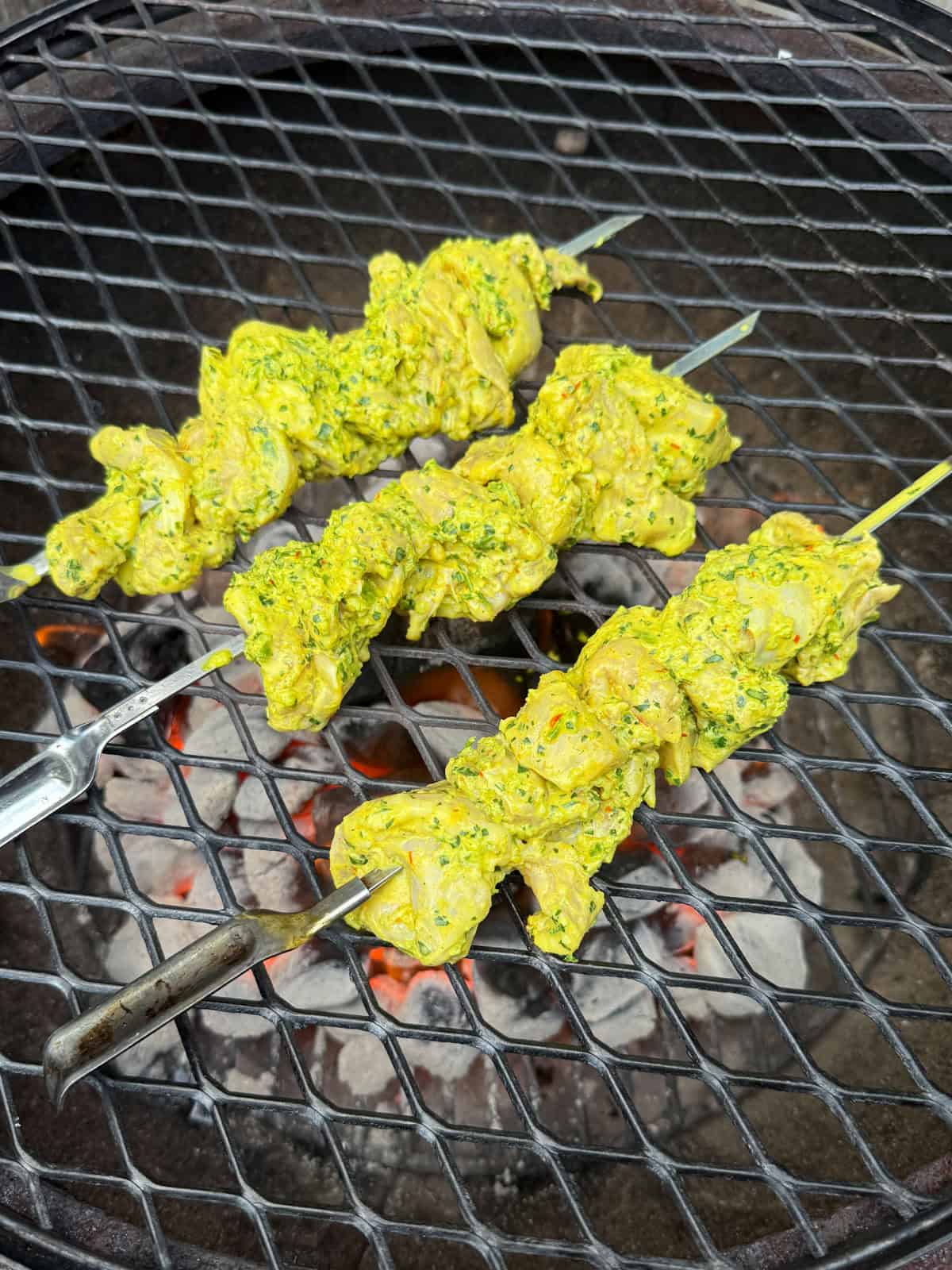 Skewer the yogurt marinated chicken and grill on all sides until cooked through.