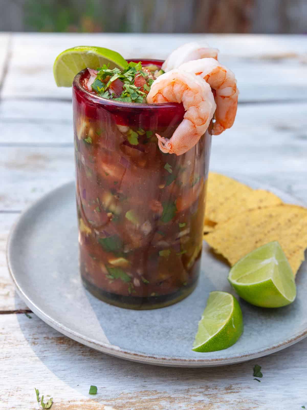 Serve Mexican shrimp cocktail with tostadas and fresh lime.