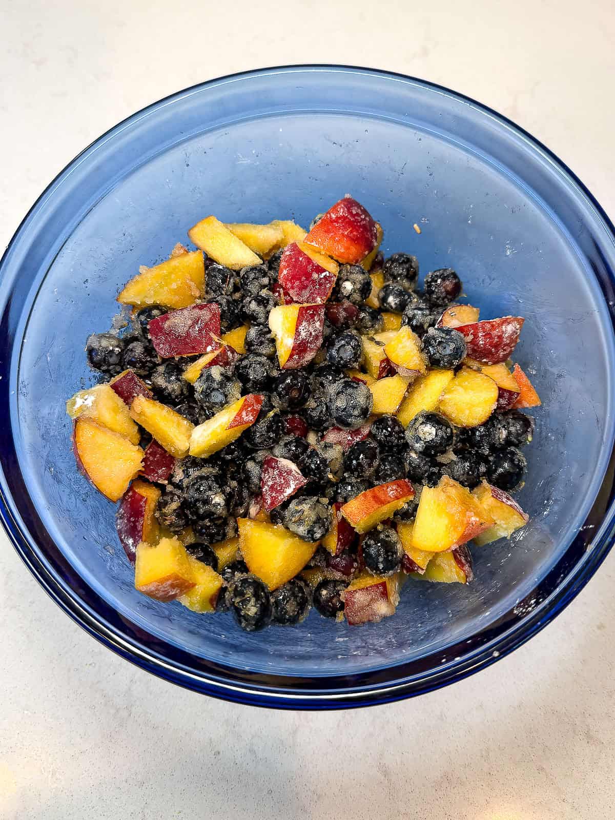 Toss the blueberries and peaches with sugar, cornstarch, lavender and lemon.