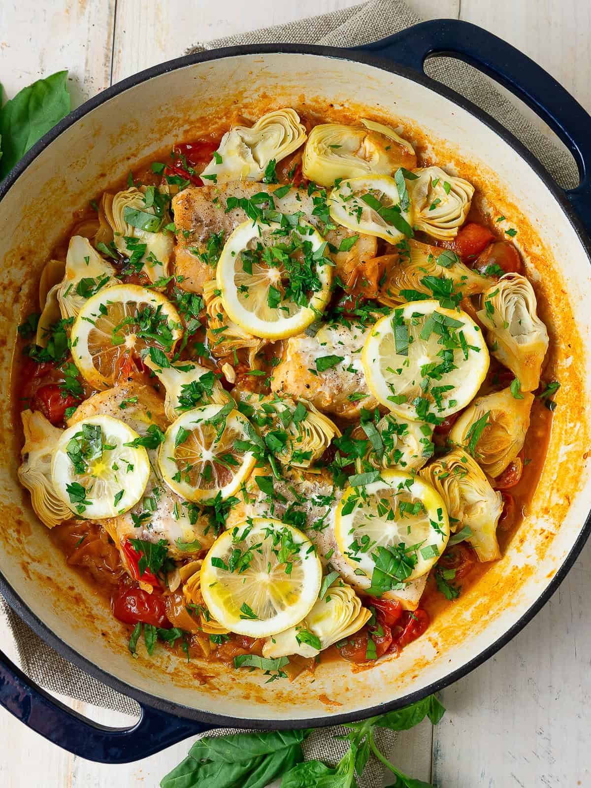 One pan cod with cherry tomatoes, artichoke hearts and fresh lemon.