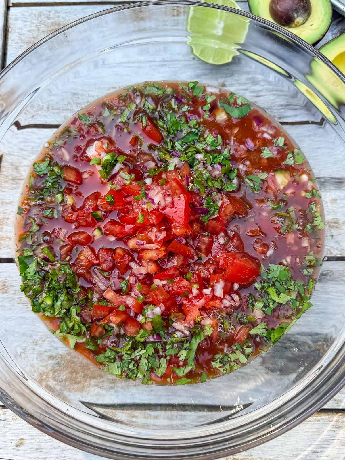 Add the shrimp, vegetables and herbs to the clamato mixture.