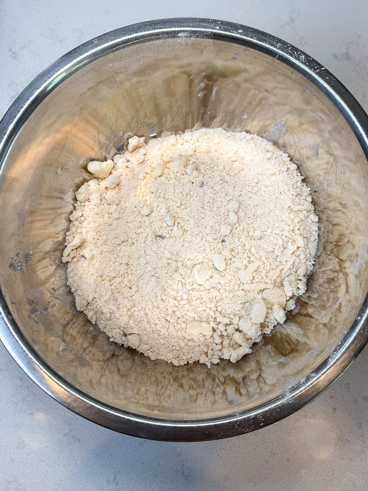 For the cobbler topping, use your fingertips to mix the cubed butter with flour and lavender.