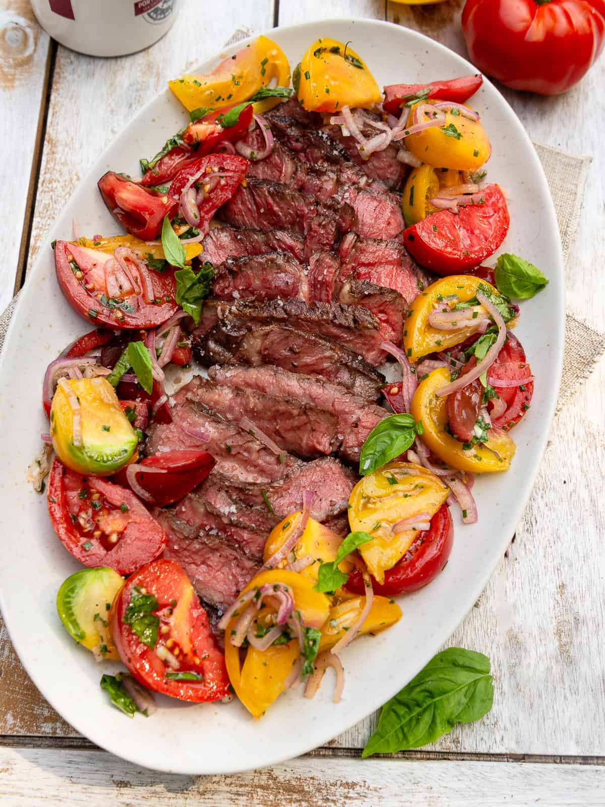 Grilled ribeye steak salad with heirloom tomatoes, shallots and fresh herbs.