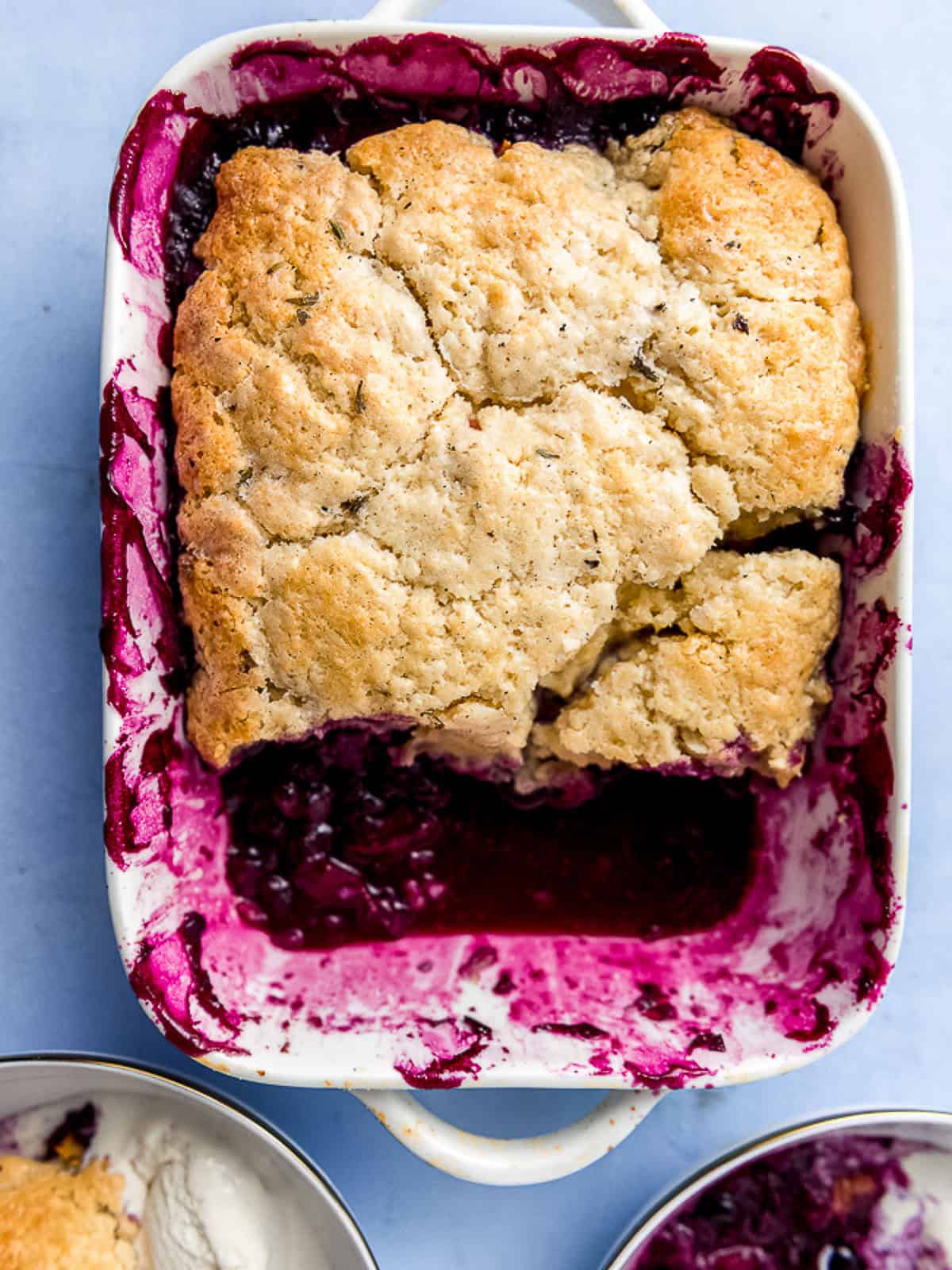 This blueberry peach cobbler is topped with a golden biscuit topping that's flavored with lavender and lemon.