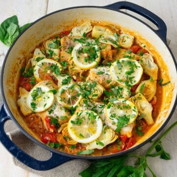 This one pan cod recipe is made with cherry tomatoes, artichoke hearts and fresh lemon.