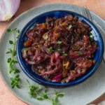 This easy onion agrodolce is flavored with garlic, sweet golden raisins and tangy vinegar.