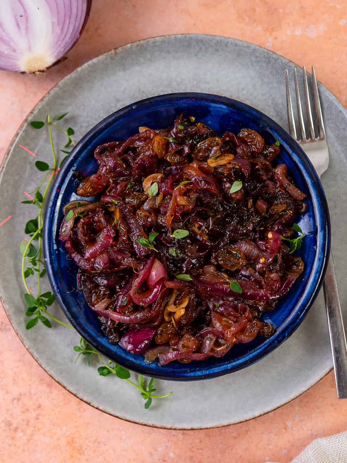 This red onion agrodolce is sweet and tangy and flavored with golden raisins, garlic and vinegar.