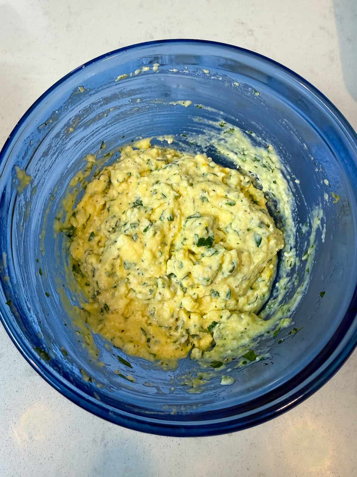 Make the ricotta mixture by mixing together the ricotta, parmesan cheese, egg, herbs and lemon zest.
