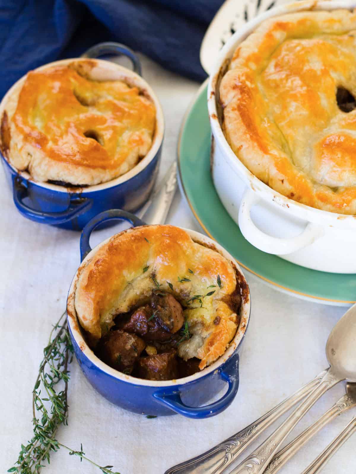 Homemade Beef Bourguignon pot pie with golden puff pastry crust.