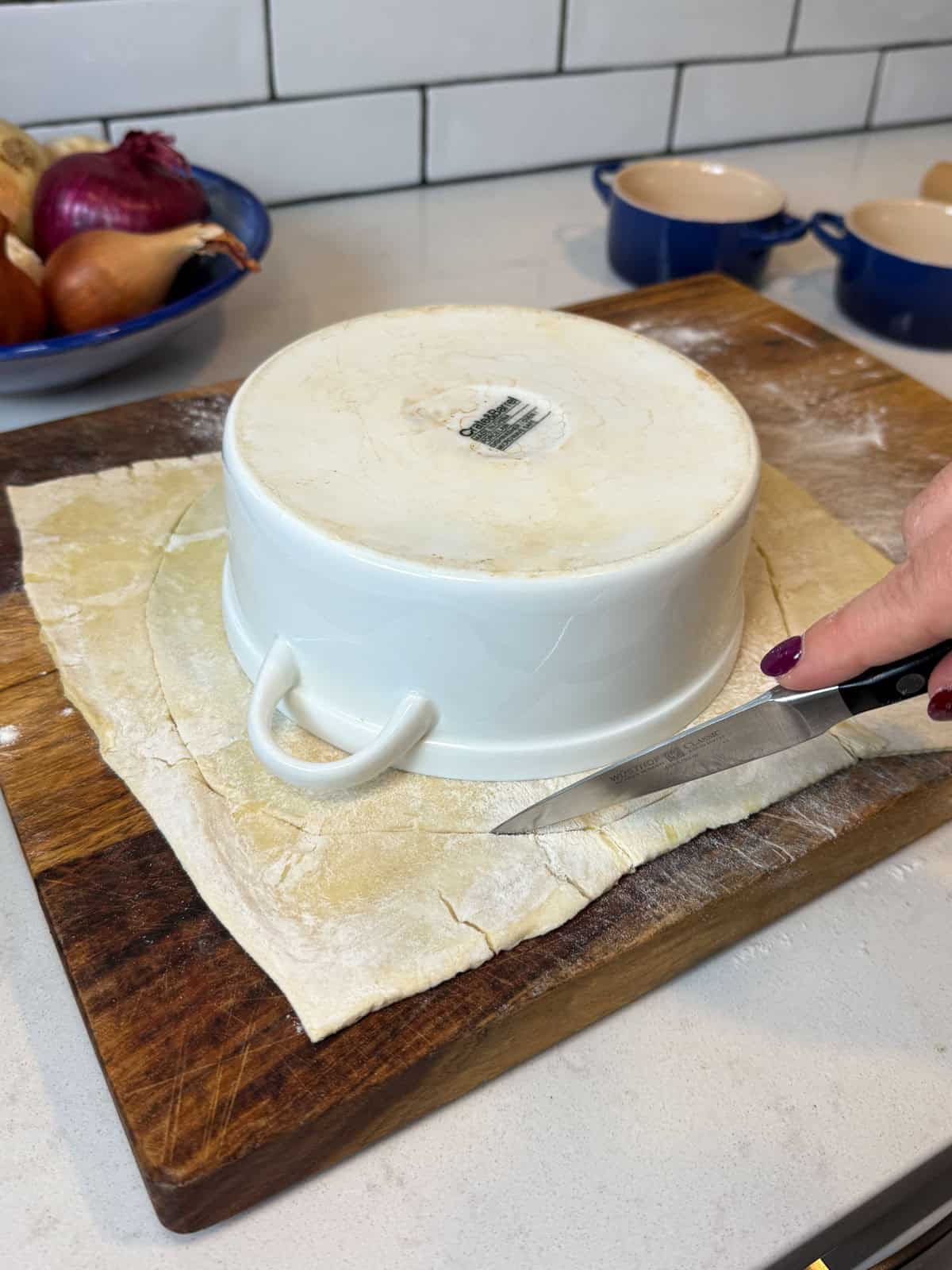 Cut the puff pastry to fit the top of the baking dish, leaving a bit of excess dough.