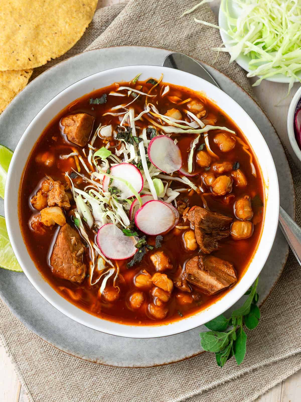 This hearty pozole rojo is made with a flavorful chile-based sauce, pork and hominy.