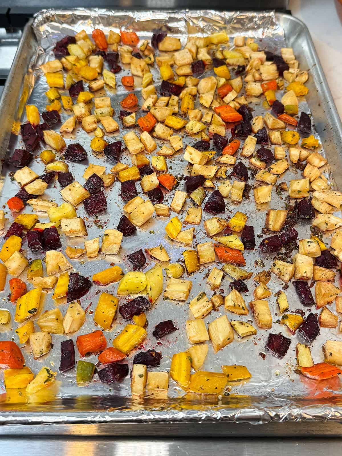 Season the cubed root vegetables with garlic, herbs, olive oil and salt and pepper and roast until tender.